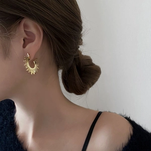 Elegant gold C-shaped sunburst earrings for women with a modern geometric fringe design