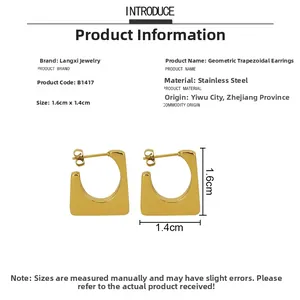 Detail view of gold stainless steel trapezoid earrings showing 1.6cm x 1.4cm dimensions