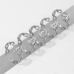 Set of five adjustable stainless steel letter rings A to E with hollow chain design