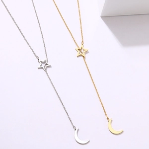 Elegante collar de acero inoxidable dorado y plateado con estrellas y colgante de luna