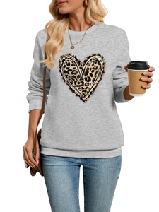 Close-up of light grey sweatshirt featuring a leopard print heart and ribbed cuffs