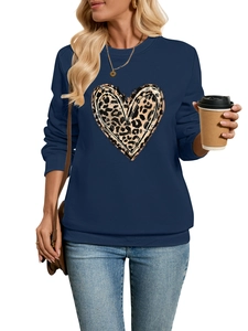 Close-up of navy blue sweatshirt featuring a stylish leopard print heart design on soft fabric