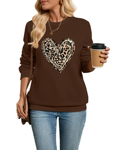 Detail of dark brown sweatshirt with leopard heart print and ribbed cuffs