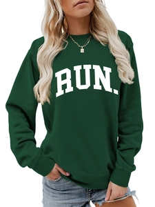 Close-up of the ribbed crew neck and white RUN lettering on a green sweatshirt