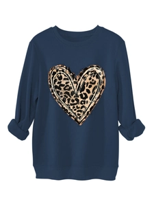 Detail of dark blue sweatshirt featuring leopard print heart and ribbed cuffs