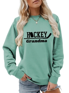 Détail des poignets côtelés et du tissu vert menthe du sweat-shirt HOCKEY Grandma