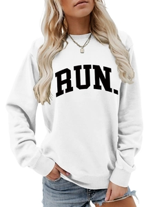 Detail view of RUN letter print and ribbed neckline on white loose sweatshirt