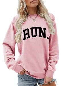 Detail of pink sweatshirt with RUN lettering and ribbed cuffs on sleeve and neckline