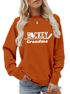 Détail du sweat HOCKEY Grandma orange brûlé avec impression blanche et bords-côtes