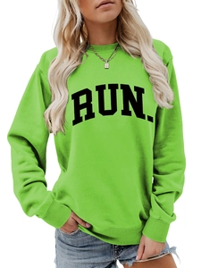 Detail of bright green RUN letter print sweatshirt with ribbed crew neck and cuffs