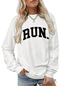 Detailed close-up of RUN letter print on light grey cotton blend crewneck sweatshirt