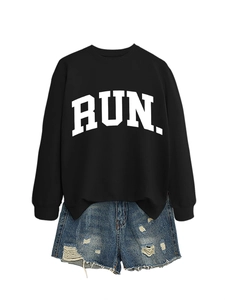 Detail of RUN letter print sweatshirt and distressed denim shorts street style outfit