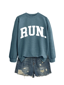 Detail of greyish-blue RUN sweatshirt with ribbed cuffs and distressed denim shorts