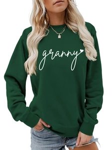 Detail of white granny print and heart icon on dark green crewneck sweatshirt