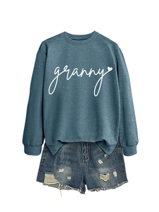 Detail of blue sweatshirt with granny print and distressed denim shorts texture