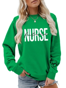Detail of green nurse future sweatshirt featuring white letter print and stethoscope sleeve icon