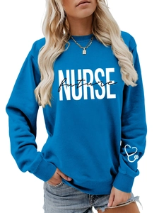 Detail of navy blue sweatshirt showing white NURSE Future print and heart stethoscope on cuff