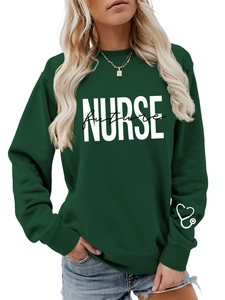 Detail of dark green nurse sweatshirt with heart stethoscope print on sleeve cuff