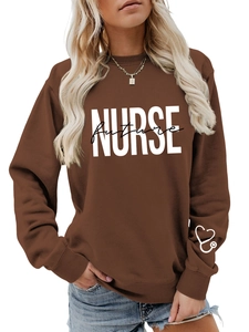 Detail of a brown sweatshirt with Future Nurse text and heart stethoscope on the sleeve