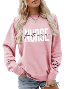 Pink crewneck sweatshirt detail showing Future Nurse print and stethoscope cuff embroidery