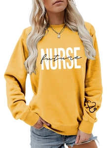 Detail of ginger yellow sweatshirt featuring Future Nurse print and heart stethoscope cuff