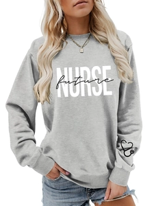 Close-up of ribbed cuffs and heart stethoscope print on grey nurse sweatshirt