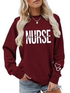 Detail of burgundy sweatshirt featuring Future NURSE white and black text print on front