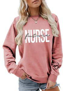 Detail of dusty pink nurse hoodie with future script print and stethoscope on cuff