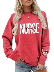 Close-up of red sweatshirt cuff featuring a white heart stethoscope medical print