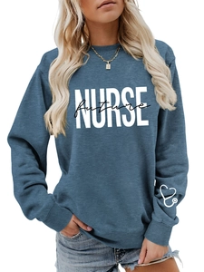 Detail view of Future Nurse blue sweatshirt showing soft fabric and stethoscope sleeve print