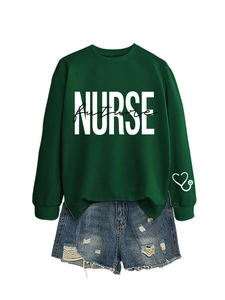 Detail of dark green nurse future sweatshirt with white stethoscope print on the sleeve cuff