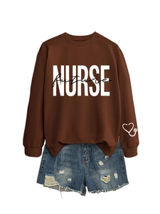 Detail of nurse future print on brown sweatshirt with heart stethoscope pattern on sleeve