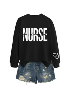 Detail view of black nurse future sweatshirt with heart stethoscope print and denim shorts