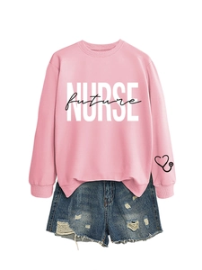Close-up of pink long-sleeve sweatshirt with white Nurse Future print and stethoscope detail