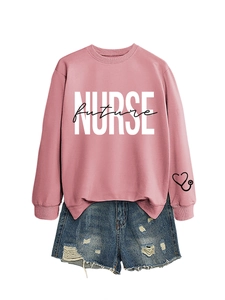 Close-up of Future Nurse print and heart stethoscope detail on pink long sleeve sweatshirt