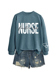 Detailed view of the embroidered nurse future lettering and stethoscope sleeve heart logo