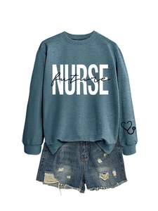 Detailed flat lay of a blue Nurse Future sweatshirt with a heart stethoscope print