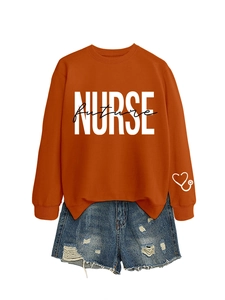 Detail of orange long sleeve sweatshirt with Nurse Future print and stethoscope on cuff