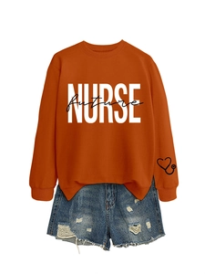 Detail of orange sweatshirt with NURSE future print and heart stethoscope sleeve design