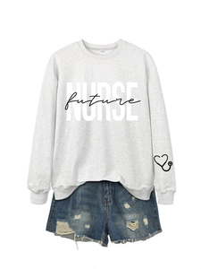 Macro detail of Nurse Future gray sweatshirt print with denim shorts ensemble