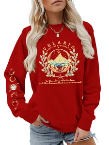 Detail of Velaris City of Starlight gold print and lunar phase patterns on a red sweatshirt