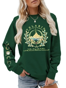 Detail of Velaris City of Starlight print on dark green sweatshirt with moon phase cuff