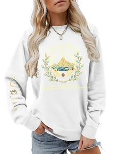 Close-up of Velaris print and moon phase symbols on white cotton sweatshirt sleeve