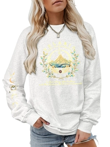 Detail of Velaris mountain print and celestial sleeve pattern on grey sweatshirt