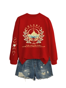 Detail of red Velaris City of Starlight sweatshirt with celestial moon phase sleeve prints