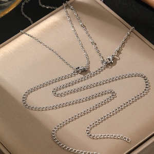 Double-layered silver body chain with metal tassels for women in minimalist resort style
