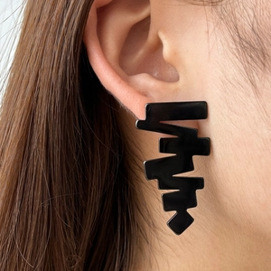 Modern black geometric jagged drop earrings for women with a glossy finish and artistic style