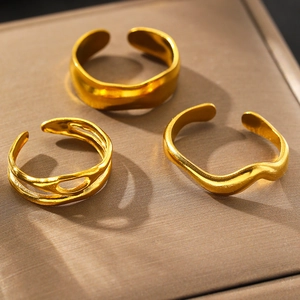 Three-piece gold plated irregular open ring set with lava texture and wave designs