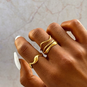 Fashionable wave pattern gold stainless steel rings with layered geometric design