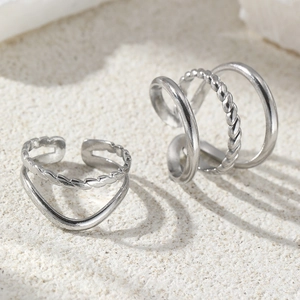 Set of two silver stainless steel ear cuffs with twisted and smooth layered design